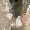WB NE area. Wall [263] in the foreground. Floor [261] in the background facing NE