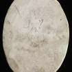 Verso of plaster cast intaglio of a man's head inscribed '8 9 7 12'.