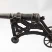 Cast iron model of a cannon.
