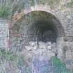 Illustration 16: S facing shot of North kiln, NW tunnel entrance showing brick vaulting