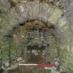 llustration 23: S facing shot of South kiln showing N draw-hole with segmented arch