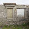 Rodel churchyard. Detail showing old and new panels in the burial enclosure of Donald Macleod of Berneray d.1781.