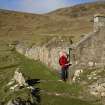 Ian Parker (RCAHMS) surveying House 13.