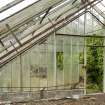 General view of glass dividing wall, doorway, mechanisms and floor grill in easternmost section of greenhouse, Walled Garden, Housedale, Dunecht House.
