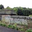Graffiti on the stone parapet at the north end of west side of the bridge.
