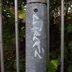 View of graffiti on a lamp-post on the footbridge.