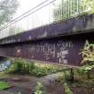 A view of some of the graffiti on the steel beam supports of the footbridge.