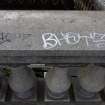 Graffiti on the west parapet of the bridge at its N end.