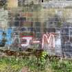 Graffiti on the inner face of the southern boundary wall of the graving docks.