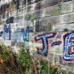 Graffiti on the inner face of the southern boundary wall of the graving docks.