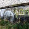 Graffiti on the inner face of the southern boundary wall of the graving docks.