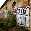 Example of graffiti on the walls (internal and external) of pump house standing on N side of graving dock no. 1.