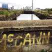 Example of graffiti on the wall to the east of the main access road to the docks.