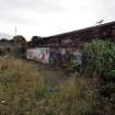 Graffiti on the inner face of the boundary wall on the west side of the dock area.