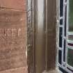 Graffiti incised into a window surround on the south side of the church.