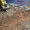 Ph1. Working shot showing sand levelling layer beneath slabs