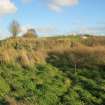 Archaeological evaluation, E-end of site showing modern scarping, in-filled area and boggy ground, Olympic Rings, Dundonald, Ayrshire