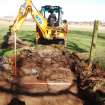 Archaeological Evaluation photograph, Lower Gauls Barrow, Retaining wall 0204 and bank material 0205