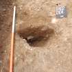 Archaeological Evaluation photograph, Lower Gauls Barrow, Context 0104, half-sectioned