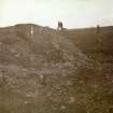 Photograph, distant view of five men working at Hillhead Broch. 