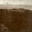 Photograph of man and a woman standing on top of Elsay Broch. 
