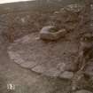 Excavation photograph showing curved wall at Elsay Broch. 
