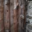 View from NW of the modern timber partition wall that separates the NW end of the barn from the SW end of the byre.