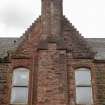 Detail of gable and chimneystack on north-east corner of Ravenscraig Hospital, Greenock. 
