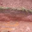 Watching brief photograph, The Snabs, North-northwest-facing section of Roman ditch, after rain