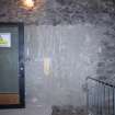 Standing building recording, General view of wall with door, 343 High Street, Edinburgh