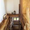 Interior view looking down staircase from first floor to ground floor of extension room in house at The Steading, Nether Blainslie.