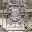 View of cartouche, possibly during the construction of the Labour Exchange in Edinburgh or Portsmouth, England, showing the sculptor Joseph Hayes.