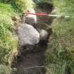 Archaeological evaluation, Structure 4- slot following partial removal of stone, Aberchalder Burn and Allt A'Choire