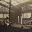 Photograph showing three craftsmen at work in the workshops of Thomas Hadden.