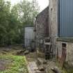 View from north showing remains of both waterwheels ('start and awe' or paddle type). The northernmost (meal mill) wheel remains are nearest the camera, with the barley mill waterwheel beyond - mill lade fed from the Culter Burn 