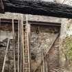 Interior. Ground floor. Meal mill area. View looking west towards kiln outer wall with access door at former first floor level