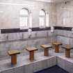 Interior view showing ground-floor washing room from west, in Mosque, Forth Street, Glasgow.
