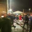 General view of fans exiting the stadium by the south east exit taken from the south. Under floodlights.