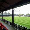 General view from main stand to football pitch and west covered terracing taken from the east.