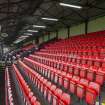 General view of the upper seating area of the main stand taken from the west.