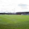 General view of the football pitch to the main stand and east covered terracing taken from the north west.