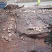 Archaeological excavation, General view of walls 109 and 110 and deposit 121 during excavation, Queen Street, Jedburgh