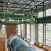 Interior.  General view showing Turbine Hall, crane and MC2 generator set. 