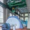 Interior.  Turbine Hall. Ground floor.  View from east of alternator and generator (direct current) of MC2 with electric overhead maintenance crane above