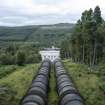 View from south of pipelines/penstocks carrying water by gravity to Tummel Bridge Power Station's two generator sets