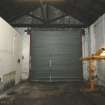Historic building survey, Unit 1, N facing interior gable with steel roller doors, 9 West Harbour Road, Granton