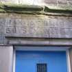 Detail of carved stone lintel above doorway to No 84 Canongate, Nisbet of Dirleton's House, 82-4 Canongate, Edinburgh.