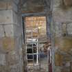 Watching brief, Working shot of the removal of 19th century masonry blocking the window of the Norman part of the church, 401-2 Strathbrock Parish Church, Uphall