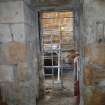 Watching brief, Working shot of the removal of 19th century masonry blocking the window of the Norman part of the church, 401-2 Strathbrock Parish Church, Uphall