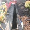 Watching brief, Pipe trench looking towards the church, 401-2 Strathbrock Parish Church, Uphall